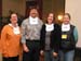 On the last day, new NEMO programs were awarded the traditional NEMO Network bib. Seen here are Emma Melvin (VT), Derek Godwin (OR), and two nemoids who will soon be able to put the bibs to very good use:  Sue Zaleski (CA) and LaMarr Cannon (ME).